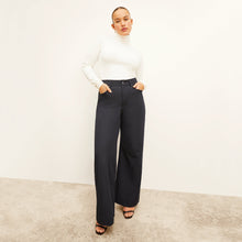 Front image of a woman standing wearing the Milo Jean in ink | Exclude