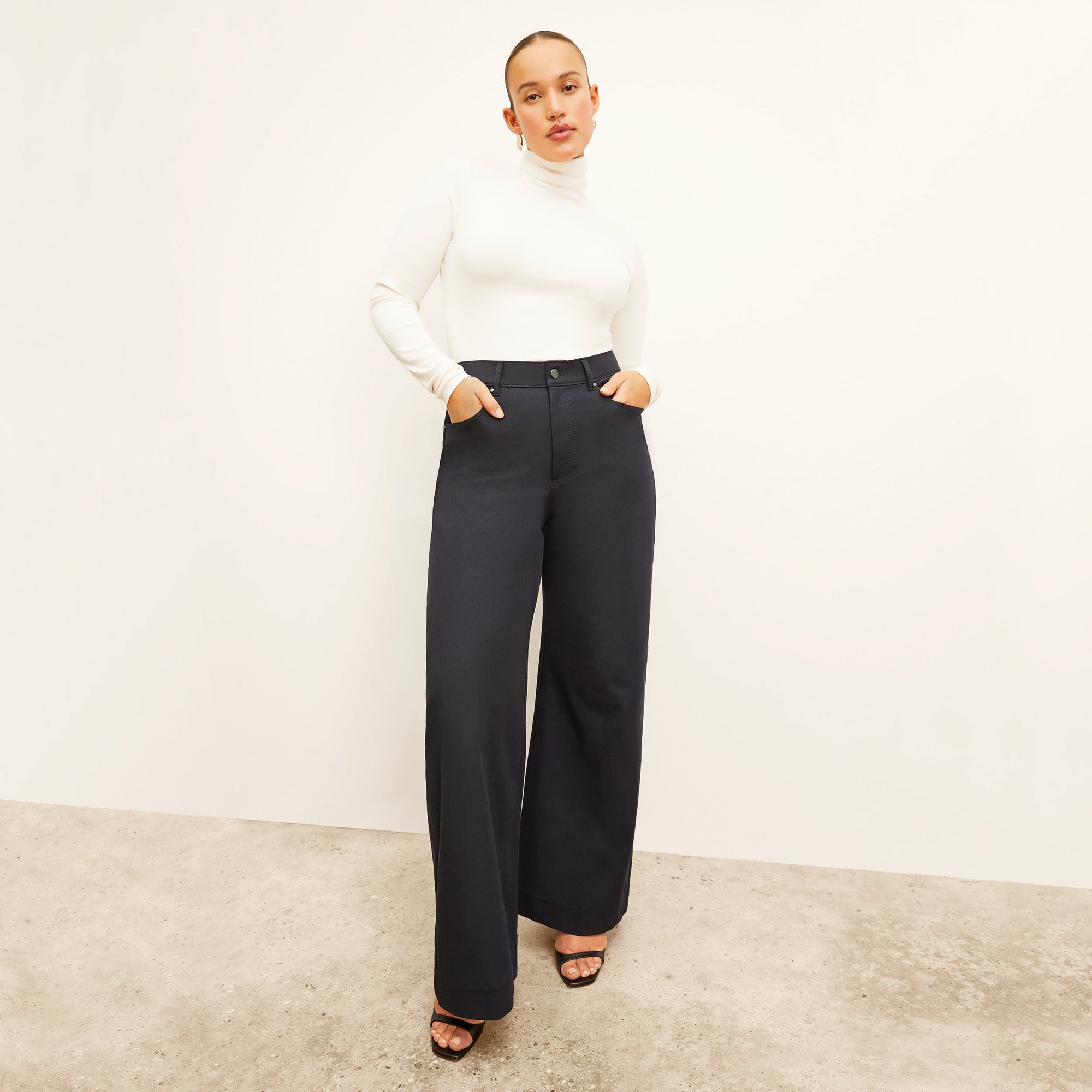 Front image of a woman standing wearing the Milo Jean in ink | Exclude