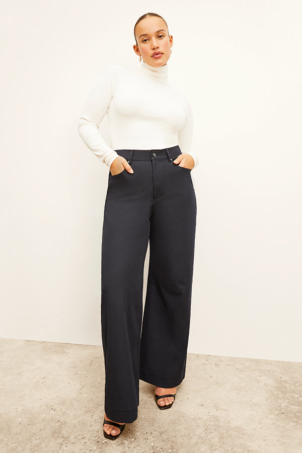 Front image of a woman standing wearing the Milo Jean in ink | Exclude