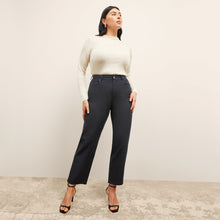 front image of a woman wearing the brodie top in ivory