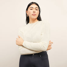 front image of a woman wearing the brodie top in ivory | Lead