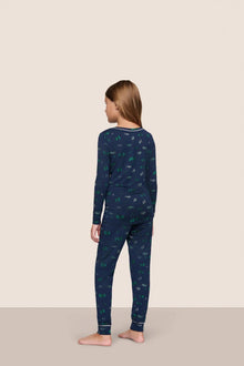 Model is wearing Kids Printed TENCEL Modal Unisex Long PJ Set  in Forest Pine Navy/Ivory