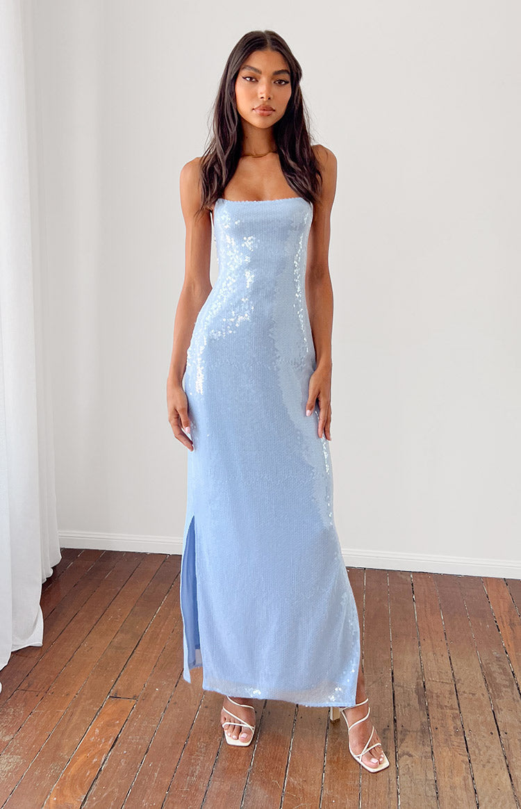 Close-up of the light blue mesh fabric with scattered sequins on the bodice of the slip dress showing a thin strap
