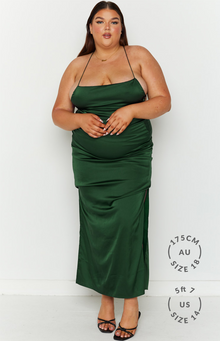 Emerald green satin maxi dress with a straight neckline, thin spaghetti straps, and a ruched side slit