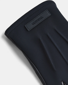 A close-up of the KRISTOPHER - 6423502 Black mens leather glove by Rudsak, showcasing detailed stitching and a rectangular patch embossed with the brand name, makes this accessory a standout in winter fashion against a light background.