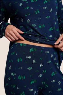 Model is wearing Gisele Printed TENCEL Modal Crewneck PJ Set  in Forest Pine Navy/Ivory