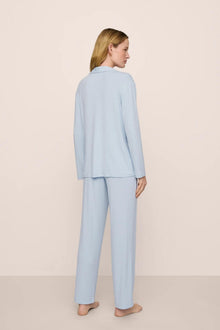 Model is wearing Gisele TENCEL Modal Rib Long PJ Set in NantucketBreeze