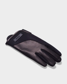 A single ERIK - 6423500 Black mens leather glove by Rudsak is laid flat on a light gray surface, featuring smooth leather, fabric trim, and a small rectangular Rudsak label near the wrist—ideal for stylish winter wear.