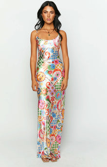 Colourful satin maxi dress with an all-over psychedelic print featuring suns, moons, checkerboards, and floral motifs
