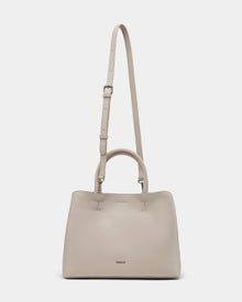 The Rudsak CATIRA S - 8325006 Vanilla women’s tote bag features beige pebble leather, a minimalist design, two short handles, a removable long strap, and a small metallic logo on the front.