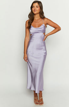 Front view of a lilac satin maxi dress with a cowl neckline, thin spaghetti straps, and side waist cutouts