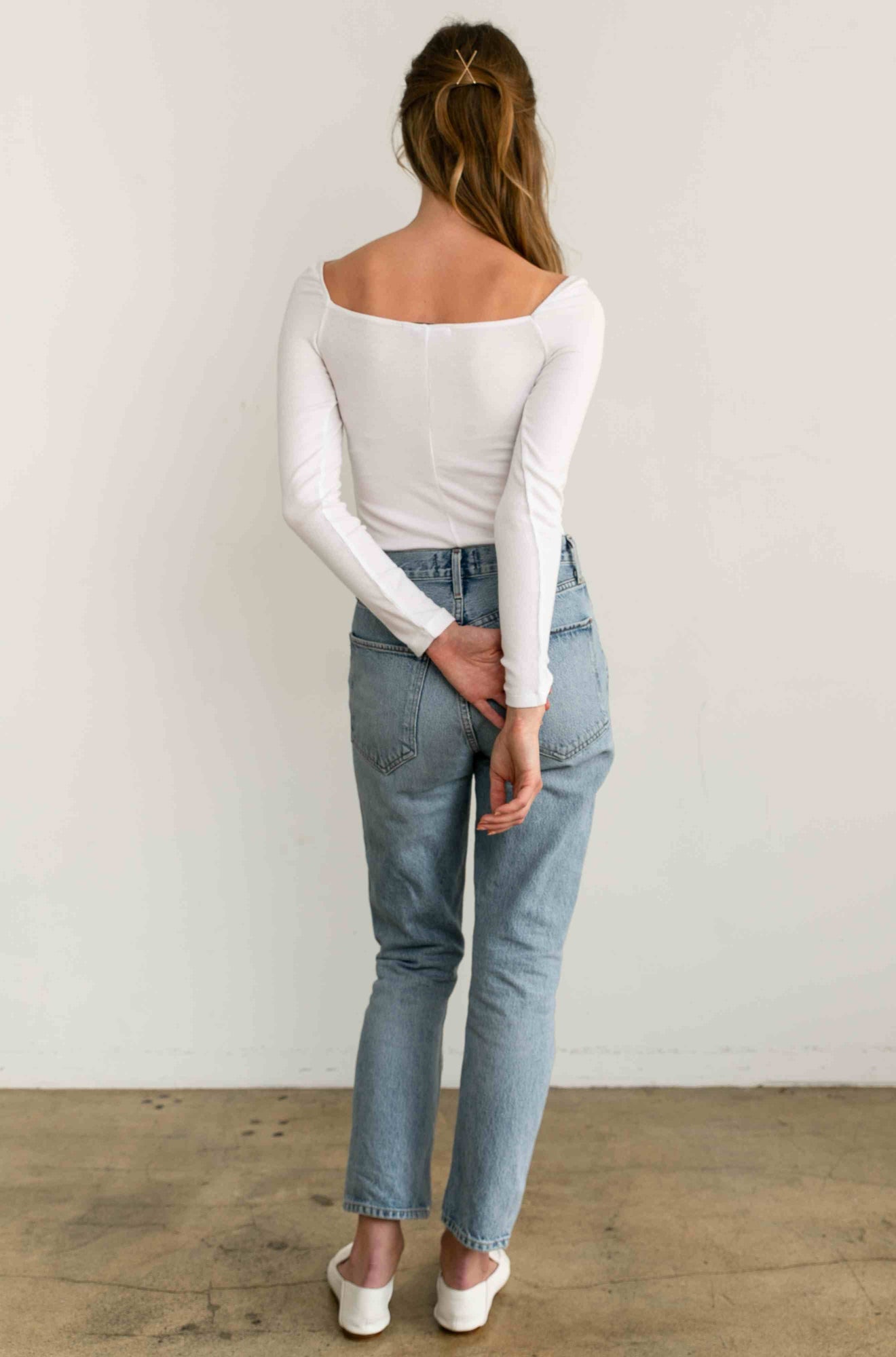 Woman wearing a white long sleeve