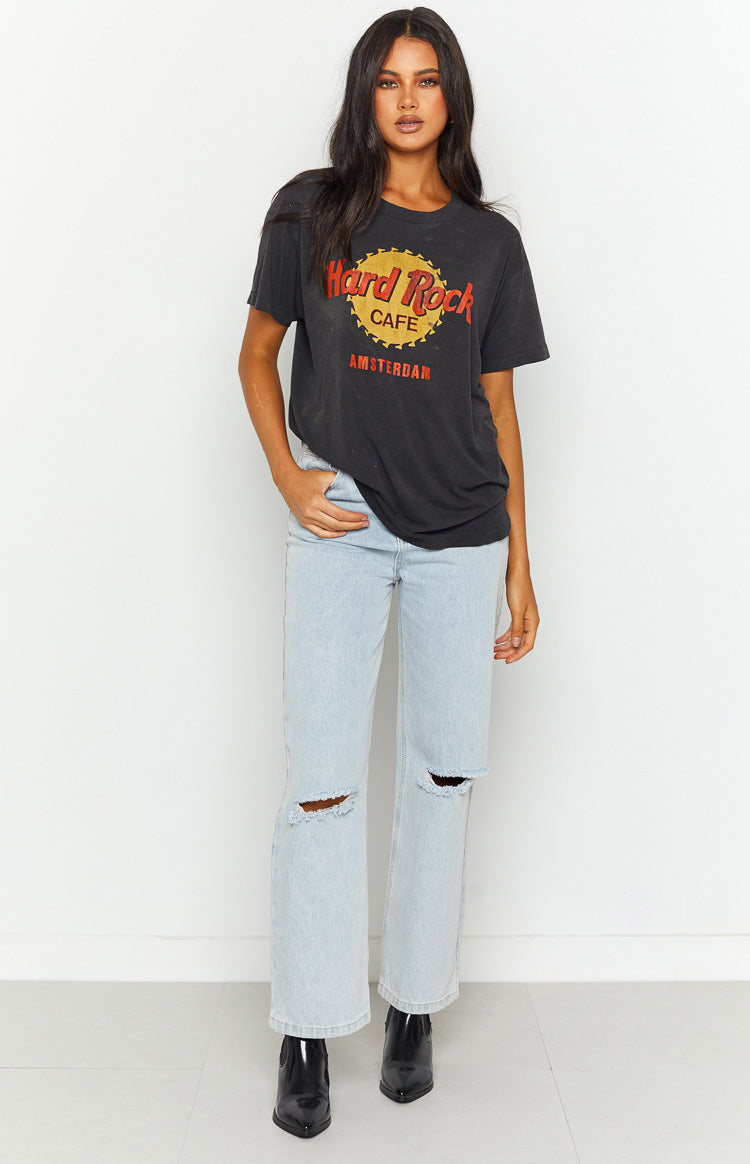 Light blue wide leg denim jeans with distressed rips at both knees