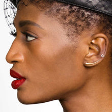 14k gold Curved Quill Climber Earrings styled on a ear