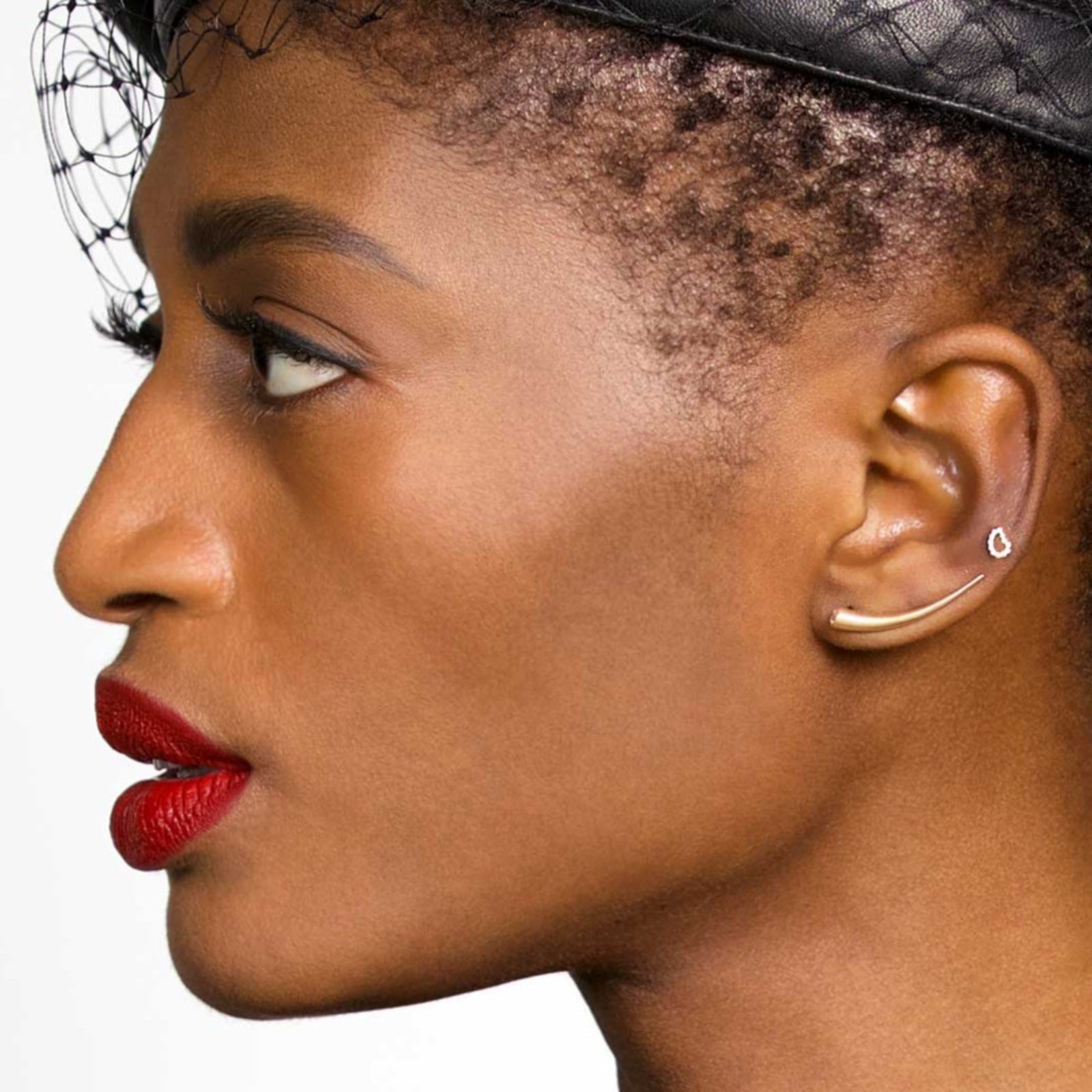 14k gold Curved Quill Climber Earrings styled on a ear