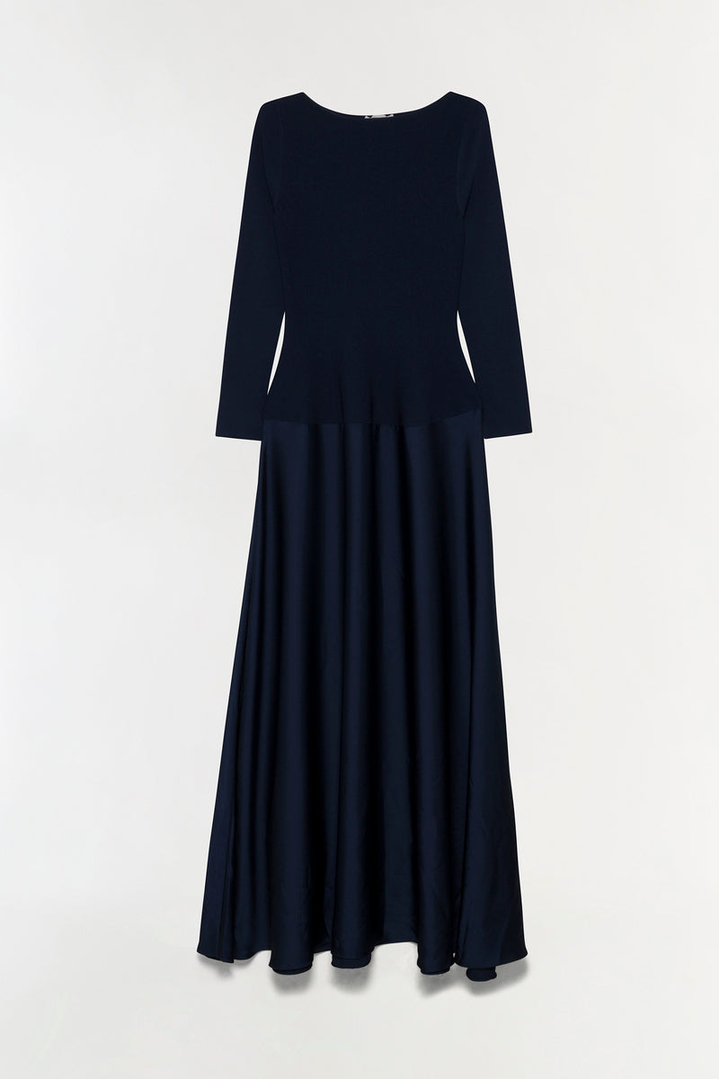 Navy satin knit gown with long sleeves, round neckline, and full-length pleated skirt.