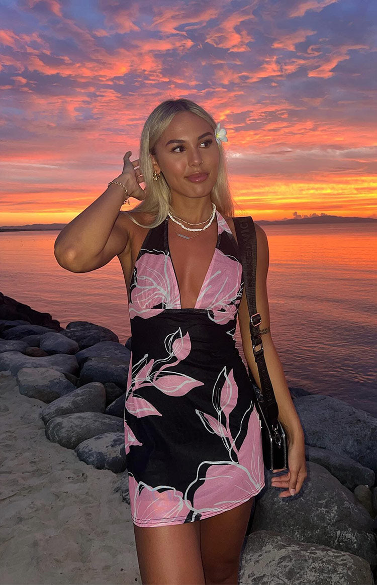 Deep V halter neckline and ruched bodice of the black mesh mini dress with pink floral print, evening