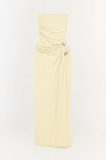 Cream strapless floor-length gown with draped bodice and side tie detail.