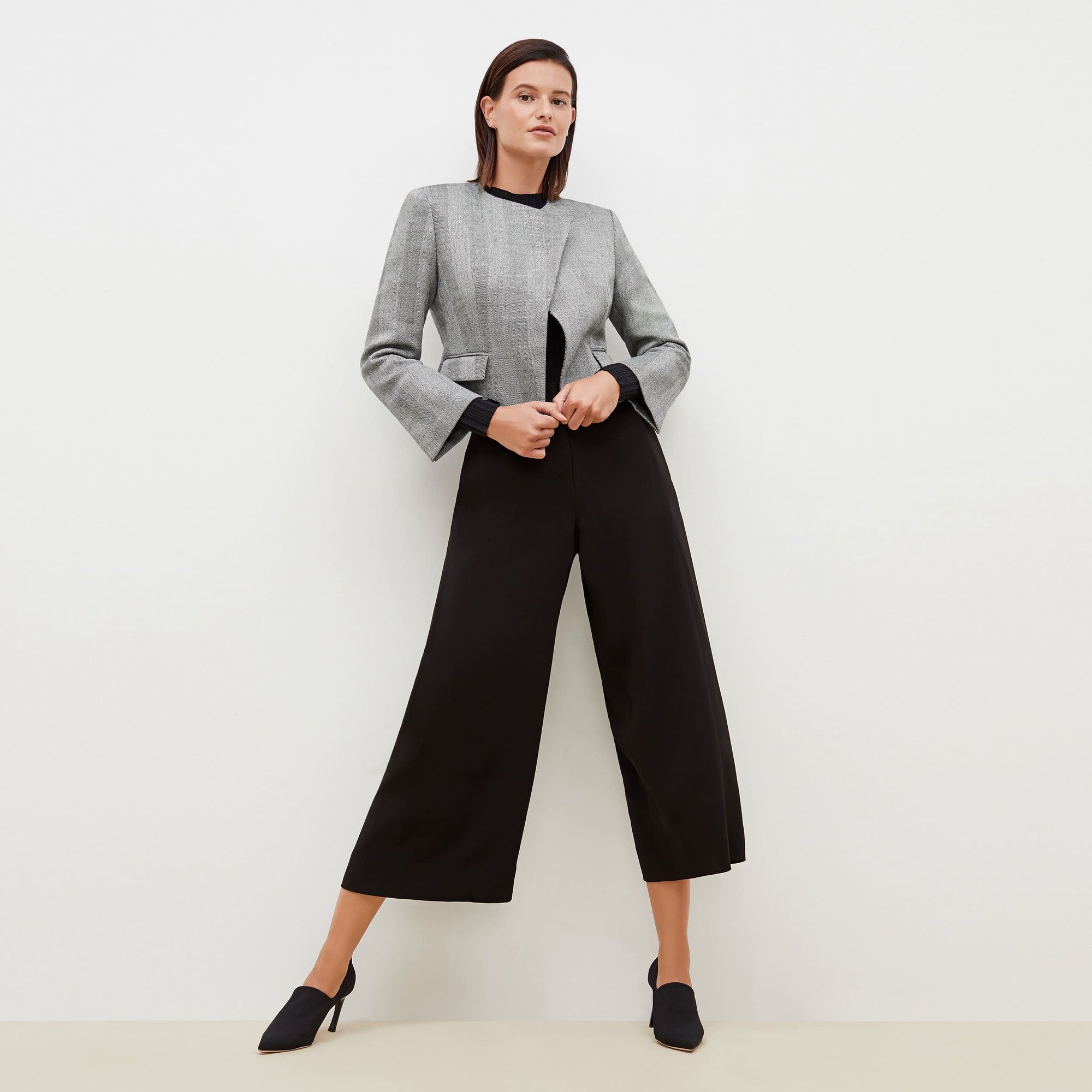 Front image of a woman standing wearing the Zhou culotte in black | Exclude