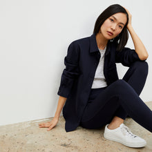Side image of a woman wearing the Harrington Legging - Light Scuba in Space Blue